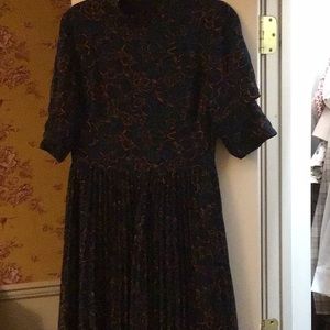 Asymmetrical pleated bottom short sleeve mock turtle neck navy dress.